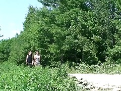 Two nasty teens pissing together on the road Part 1