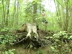 Red-haired hoochie pees off a hill in the woods Part 1