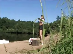 Exciting shaved teen peeing near the lake Part 2