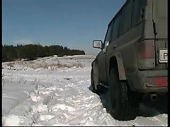 Girl pissing on snow near the car Part 1
